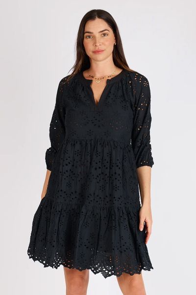 Elegance meets comfort Lula Souls stunning Adele Tiered Dress. This dress features 3/4 puff sleeves with delicate elasticated cuffs that add a playful and feminine touch to the ensemble. It also has intricate broderie anglaise detailing that adorns the fa