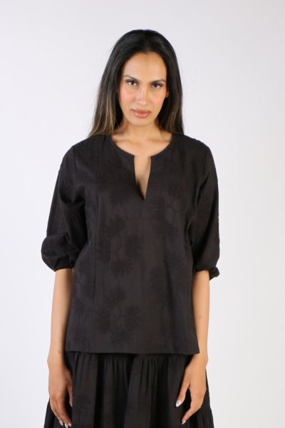 Go for easy vibes this season in this Elka top by Bagruu. In a round split neck and a panelled design, the top has peasant sleeves and can be styled with easy pants for a perfect day to night look. 