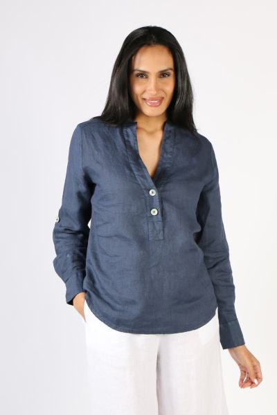Oversize is a fun look and this linen shirt by Blueberry keeps you stylish and easy. In a Washed Linen, the Notch neckline shirt with mother of pearl buttons and a mandarin collar, along with sleeve tab details. Style this shirt with easy linen pants or d