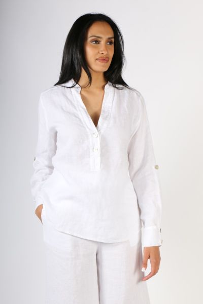 Oversize is a fun look and this linen shirt by Blueberry keeps you stylish and easy. In a Washed Linen, the Notch neckline shirt with mother of pearl buttons and a mandarin collar, along with sleeve tab details. Style this shirt with easy linen pants or d