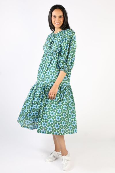 An easy breezy Shanti Dress by Boom Shankar is perfect for the season. In a block printed cotton, the dress has open neck with a front tie up with gathered sleeves and a gathered tiered design. Style it with easy sneakers.
