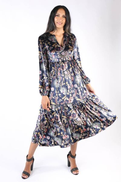 Swish to your own beat this season in this Velvet dress by Cap Jaluca. In an overall floral print, the maxi length dress has a tiered design that sashays with your every move. With long sleeves and V neck, style this dress with easy sandals. Style 5932.
