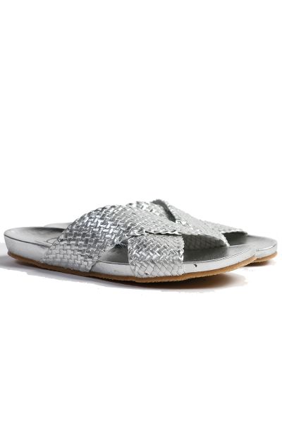 Slides by DP are a statement style made with an incredible woven textured leather. Crafted with a rounded mouled footbed and a minimal heel, this flat will match any outfit in your wardrobe. It will be staple for summertime. Style 54609NEXS2.