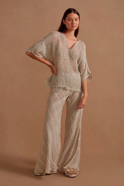 The Novo Flare Pant is a contemporary reinterpretation of the timeless flare pant, designed to elevate your style. The elasticized waistband is crafted for versatile wear, allowing you to embrace a high-waisted look or effortlessly adjust it to your prefe