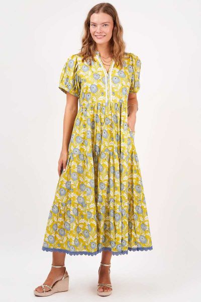 Impress the crowd at your next special event wearing this elegant new Frida Maxi featuring the exquisite cornflower florals and contrasting mustard of our Seville Print. The delicate sequinned trim down the front of the bodice and feminine, tiered, skirt 