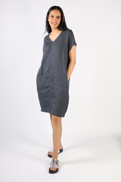 A simple elegant and very wearable shift style dress that is so easy to throw on with sneakers, or dress up if needed . cap sleeve style with V neck sitting just above the knees with side pockets with centre seam detail.