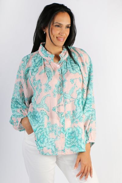 This stylish Goondiwindi Cotton Shirt Frill Collar is the perfect addition to your wardrobe. Made from Linen and garment washed for added softness, the top features an overall aqua and pink floral pattern and front button closure. Crafted with a frill col