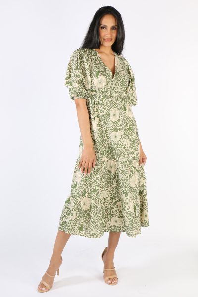 Be summer ready this season in this Garance Laetitia dress. In an overall print, the dress has a V neck and 3/4  elasticated puffed sleeves. The cinched Elasticated waist hugs you in the right places as tiered layers flare out in a flattering look. Style 