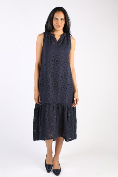 The easy cotton dress by Hammock and Vine is a head turner. In Broiderie Anglais, the Navy dress is linen lined with a nehru collar and a V Neck. With Frilled hem, the Maxi Dress can be styled with easy heels. Style 43854.
