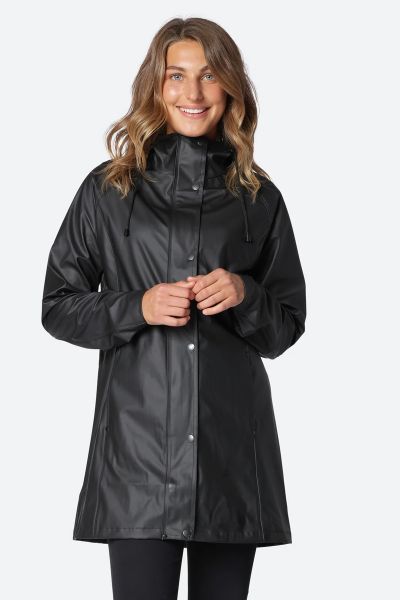 Image of a knee-length, black Ilse Jacobsen raincoat made from waterproof fabric. The coat features a front zip and button closure, a drawstring hood, and two large pockets at the hips. The coat has a flattering A-line shape and is ideal for keeping dry i
