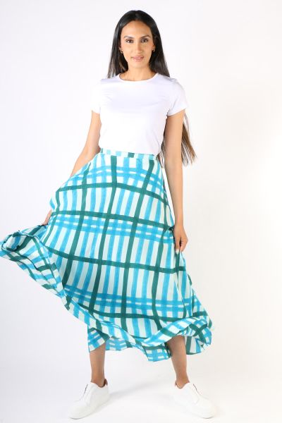 Draping effortlessly, this bias skirt is what you need this summer. Featuring a hand blocked pirnted plaid pattern, this skirt with an elastic band, sits perfectly on your waist. Hugging your curves in all the right place, this ankle length skirt can elev