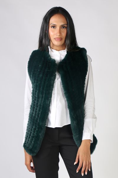 Add a little glamour to your outfits with this faux fur vets from Jump. Featuring an open waterfall style front, this sleeveless vest is perfect for layering over dresses or shirts and pants alike! Style 4611097A.