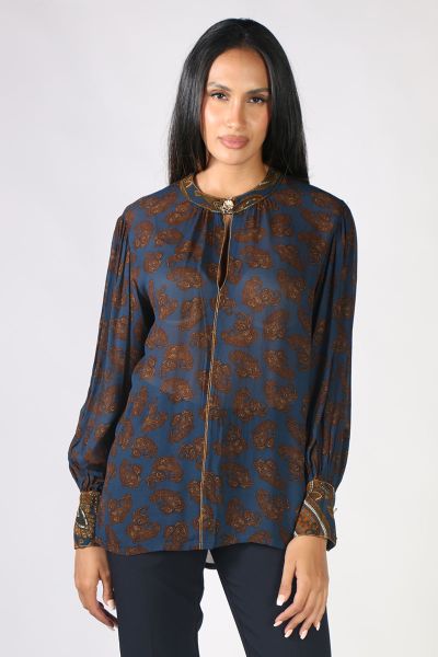 The Baroque is a stunning top in a modern, ornate paisley print with contrasting details. It features a collar with a stylish front opening, textured metal shank buttons, long drapey sleeves, and neat cuffs. Style 3392.

