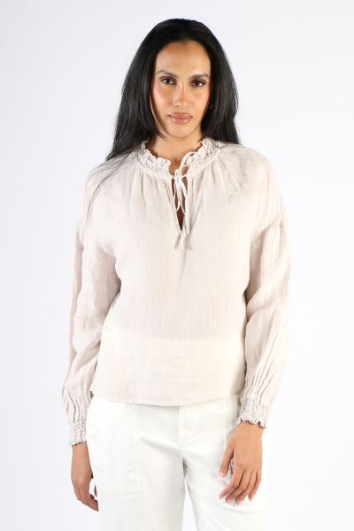 A classic piece that never goes out of style, this linen top offers a chic and stylish look. The smocked cuffs and collar with a tie adds just a hint of feminine charm, while the long sleeves provide coverage when the day starts to cool down. Pair the Bam