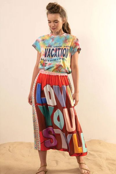 Classic fit printed pleated mix pattern vintage style midi skirt with a multi-colored Slogan. Wear it with a simple white T and sneakers for a sporty look or a white crisp shirt for a tailored fit.