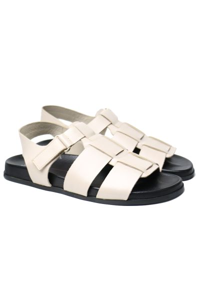 You can rely on these flat leather sandals by Mollini. Bold straps and riptape straps make this an easy everyday style. moulded footbed , platform sole and ankle strap.