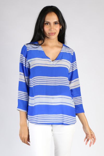 Sleek and easy, this Monica Top is the perfect everyday top that takes you from desk to dinner effortlessly. In bright tones, handblocked stripes in an overall pattern feature on a V neck top with full sleeves in a Silk Crepe de chine. Pair it with your t
