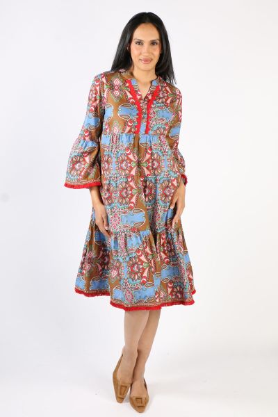 This charming Heather Dress showcases the our flamboyant and fabulous Granada Print inspired by stunning Spanish art and culture. Featuring longer, belled sleeves, striking red lace and fringed tapestry trimmings, the Heather Dress is a flattering shape f