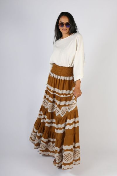 This skirt is a show stopper! Beautiful tiers of rustic pre washed cotton by Pearl & Caviar. The deep smocked waistband leads to ever increasing skirt tiers each with its own rouched detail with the woven fabrication in copper and cream. style p6152.