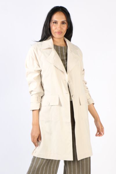 Layer up in style with this coat jacket by Ping Pong. In 100% Sanded Tencel, the edge to edge trench coat style jacket had full tab sleeves and double front ppckets. Style it over a dress or separates. Style P555402.
