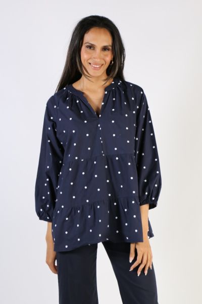This lovely embroidered spot top effortlessly blends a boho chic shape with a classic navy and white spot. Made from a soft and breathable cotton voile, this blouse features a V-neckline, full length sleeves, a tiered bodice and embroidery detail. Perfect