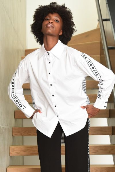 It really is This Seasons Shirt! Designed in the modern Poplin On Over cotton shirting, this piece features a striking contrasting striped back, edgy Cooper tape detailing down the arms and a trendy high low hem. Spice this shirt up with the Dont Sweat Th