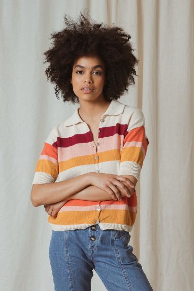The Retro Knit from Indi & Cold features sunset coloured stripes, adding a playful touch to your wardrobe. The knit has a classic shirt collar, centre front button stand and dropped shoulders. This style has a box shaped fit and ribbed trimmings. style yp