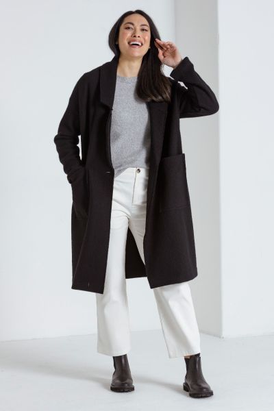 This beautiful long sleeve boiled wool coat is a must have addition to your winter wardrobe. Made from 100% wool, it offers both comfort and durability, ensuring you stay warm and stylish throughout the coldest months. The coat features a stylish collar a