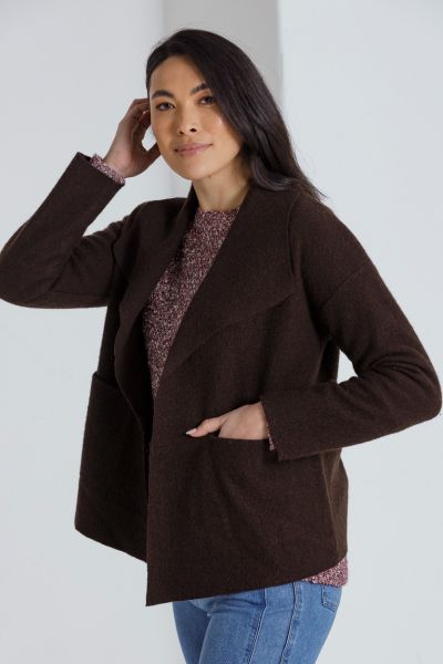 The Long Sleeve Cropped Boiled Wool Jacket is the perfect blend of style and comfort. Made from 100% wool, this jacket is warm and cozy, perfect for chilly weather. The straight hem and collar provide a sleek and modern look, while the drop shoulder desig