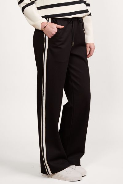 Vassalli Wide Leg Full Length Pant with Side Stripe Panel. Made from stretch twill ponte fabric for the perfect fit. Elastic back waistband with front drawstring featuring metal eyelets and aglets. Two front side angle pockets. Vassalli embroidery below b