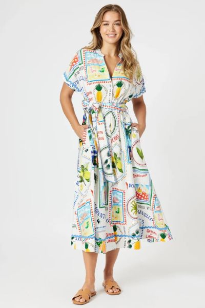Bring the spirit of the Italian coastline to your wardrobe with The Amalfi Print Dress. Featuring a vibrant Amalfi Coast inspired postcard print, this dress celebrates sunny days with playful motifs of limes, palm trees, and seaside scenes. Made from ligh