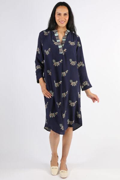 Sleek and gorgeous, this Anya Dress by Anupamaa is a perfect go to for summer nights. In an overall bird print contrasted with a striped trim, full sleeves and a mandarin collar, this silk dress is all sorts of fabulous. Pair with easy heels and assorted 