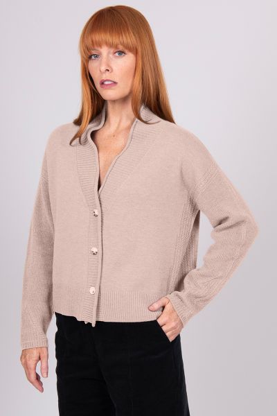 A Boxy fit relaxed cardigan with ribbed shawl collar and detailed, cable panel feature. Dropped shoulders for an easy to wear, relaxed look. High hip length. The collar can be worn high or folded for a roll collar effect. Horn-look buttons for a stylish f