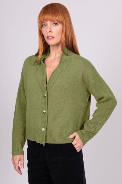 A Boxy fit relaxed cardigan with ribbed shawl collar and detailed, cable panel feature. Dropped shoulders for an easy to wear, relaxed look. High hip length. The collar can be worn high or folded for a roll collar effect. Horn-look buttons for a stylish f