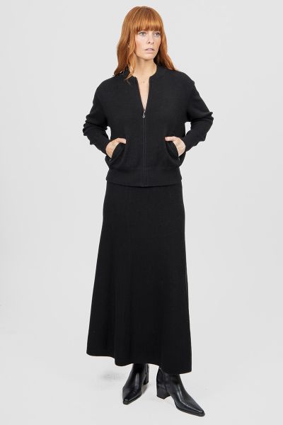 Introducing the new Flared Skirt with Wide Band, a timeless addition to your wardrobe that effortlessly blends classic silhouette and modern comfort. Crafted with meticulous attention to detail, this skirt features a flattering flared cut that drapes beau