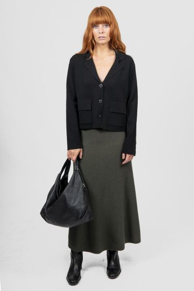 Introducing the new Flared Skirt with Wide Band, a timeless addition to your wardrobe that effortlessly blends classic silhouette and modern comfort. Crafted with meticulous attention to detail, this skirt features a flattering flared cut that drapes beau