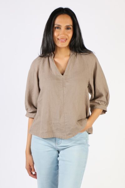 Stay comfortable in the Raglan Short sleeve Linen Top by Blueberry Italia. Made from 100% linen and featuring a short sleeve, vneck, scoop back thats slightly longer than front hem line. Is a great staple for your summer wardrobe. style 23072.