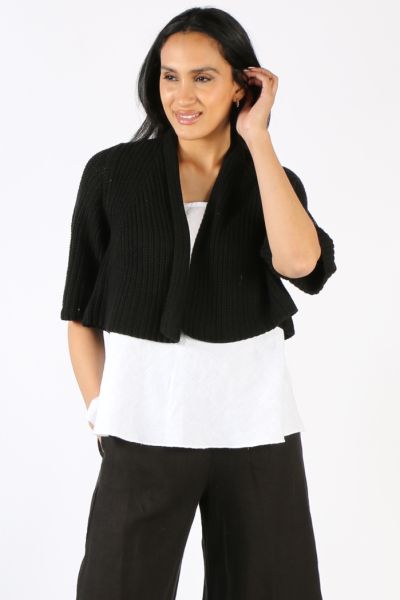 Layer up in style even in summers with this Cardigan by Blueberry. In a Fishermans knit, the edge to edge cropped cardigan has 3/4 sleeves. It can be styled over tees and tanks and paired with easy pants and denim. Style 9033.