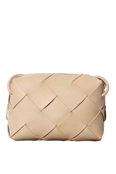 100% leather Crossbody Weave Bag By L ora D oro. comes with long strip and zip closure.