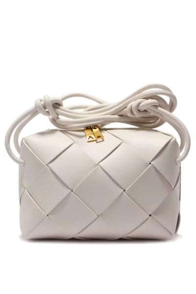 100% leather Crossbody Weave Bag By L ora D oro. comes with long strip and zip closure.