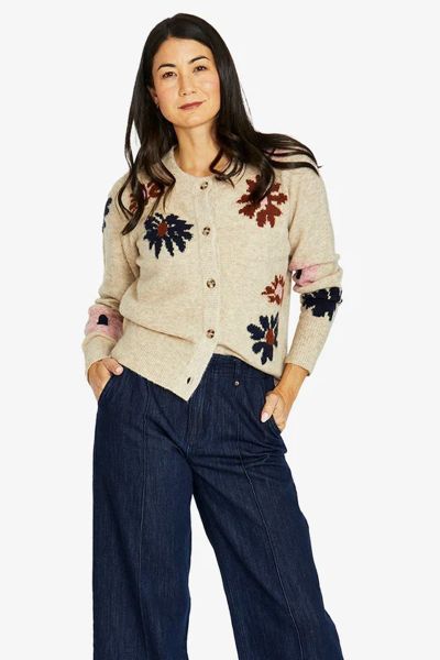 Introducing the charming Daisy Cardigan, a delightful addition to your wardrobe. The Daisy Cardigan offers a classic silhouette with a modern twist, highlighted by playful floral intarisia patterns. Its relaxed fit ensures comfortable wear, while the butt