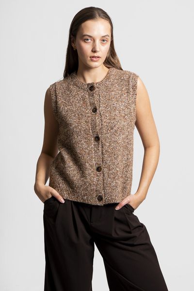 The Button Up Vest offers a fresh take on classic knitwear, merging playful texture with everyday ease and layered charm. It is a must have piece for adding dimension, creativity and warmth to your wardrobe. Crafted from a distinctive nep yarn blend, it c