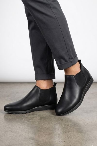 this fusion urban boot offers a sleek, minimalist aesthetic combined with all day comfort for the modern professional. These black leather Chelsea style low rise boots feature a flexible sole and elastic side panels that ensure a perfect fit for any urban