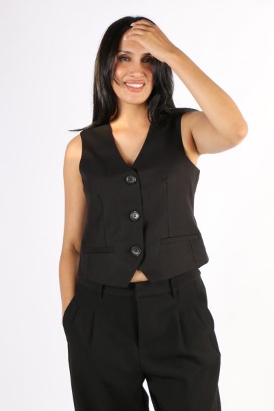 Go for a polished look in this vest by Foil. In a Wool blend, this V Neck Vest with a front button closure can be paired with denims and tailored flared pants alike. Style 8119.