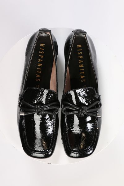 An elegant square toe moccasin made from a soft leather upper with a leather bow embellishment over the instep. Slip on and off with ease. Perfect for work, or for an elevated casual look. European sizing. Made in Spain. Leather upper, microfibre lining, 