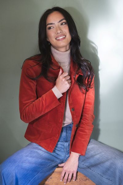 A luxe velour jacket designed to elevate your everyday layering. Crafted with a soft, brushed finish and subtle stretch, it offers both comfort and structure. The fitted silhouette gently shapes the waist for a flattering look. A refined take on a classic