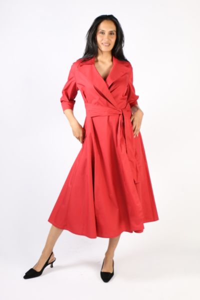 Step out in style with this illium wrap dress. In a solid color, this dress with notch wide collar lapels wraps around and cinches your waist perfectly. Hugging you in all the right places, it has 3/4 sleeves and side pockets and falls at a perfect tea le