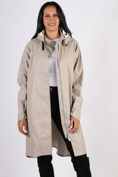 Image of a knee-length, black Ilse Jacobsen raincoat made from waterproof fabric. The coat features a front zip and button closure, a drawstring hood, and two large pockets at the hips. The coat has a flattering A-line shape and is ideal for keeping dry i