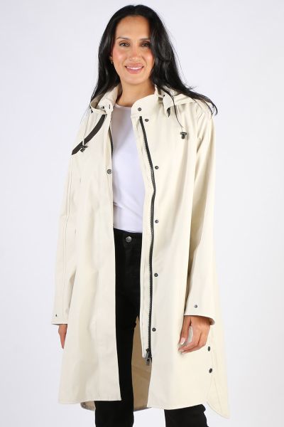 Image of a knee-length, black Ilse Jacobsen raincoat made from waterproof fabric. The coat features a front zip and button closure, a drawstring hood, and two large pockets at the hips. The coat has a flattering A-line shape and is ideal for keeping dry i