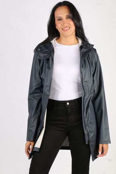 Image of a knee-length, black Ilse Jacobsen raincoat made from waterproof fabric. The coat features a front zip and button closure, a drawstring hood, and two large pockets at the hips. The coat has a flattering A-line shape and is ideal for keeping dry i